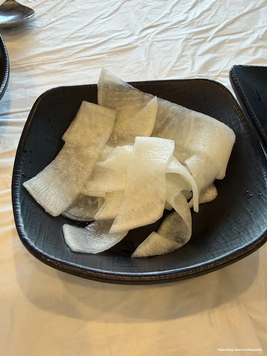 Table with makguksu, sundubu, and buckwheat gimbap together