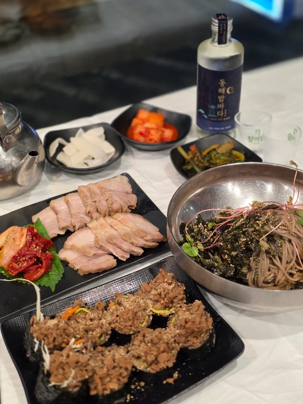 Vertical photo recording the visit to Gossi's Donghae Makguksu