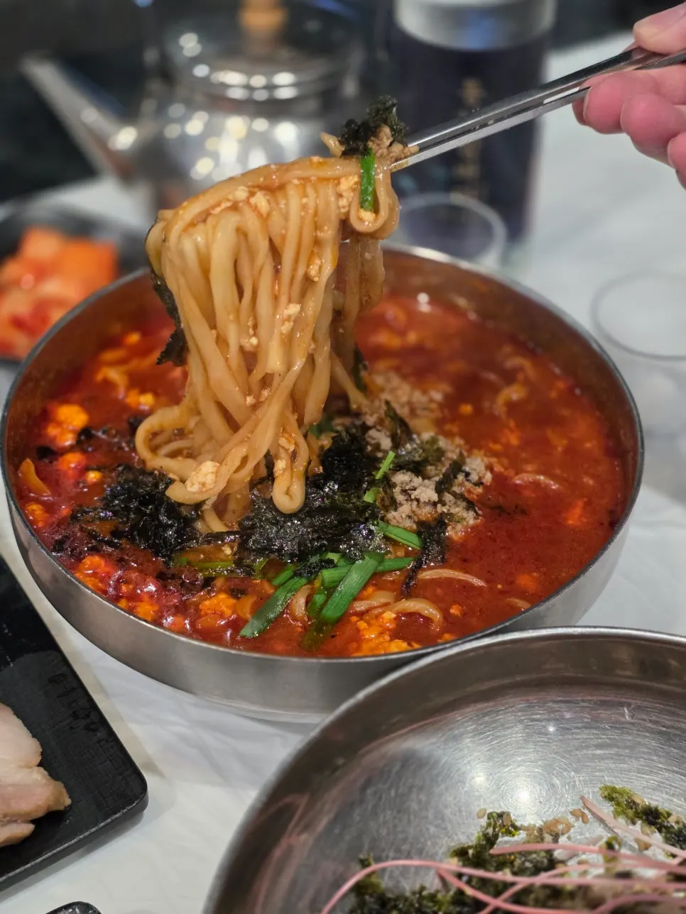 Broth showing soft, fluffy sundubu pieces