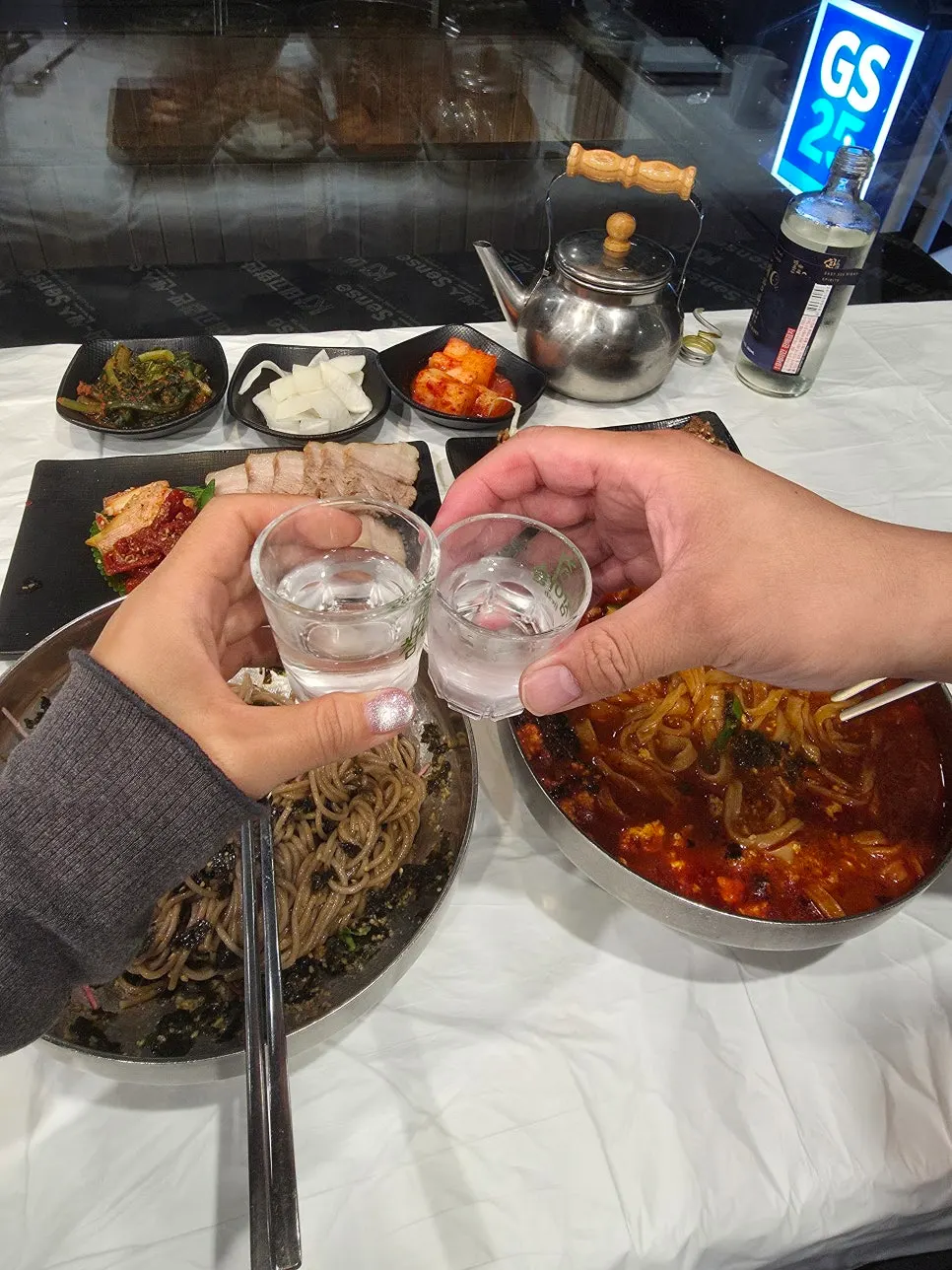 A chopstick-full of kalguksu noodles lifted up