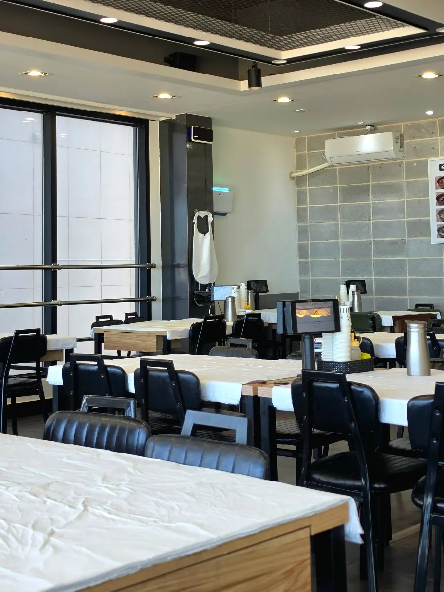 Ocean-view seating on the second floor with Gangmun Beach through the floor-to-ceiling windows