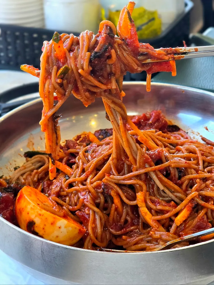A bowl of pollack sikhae bibim makguksu