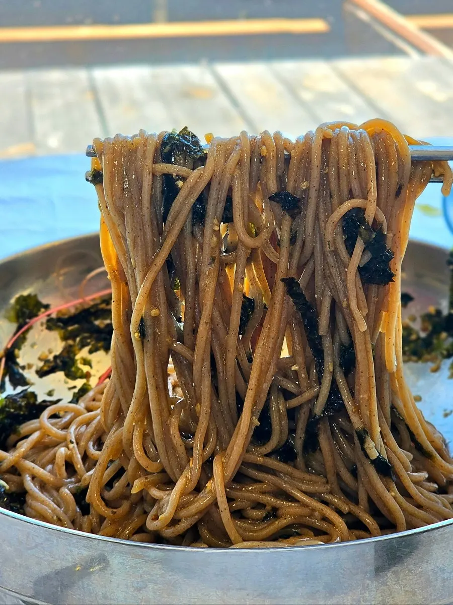 Chopsticks lifting perilla oil makguksu noodles