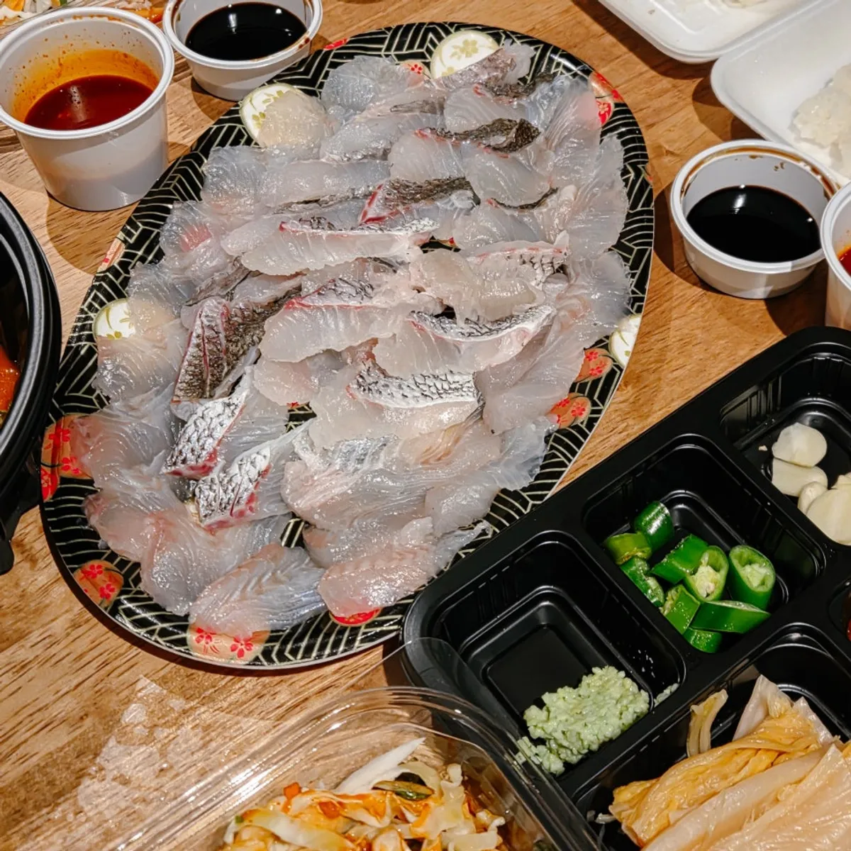Takeout sashimi and mulhoe spread from Samsami-ne Gyeongpodae Main Branch