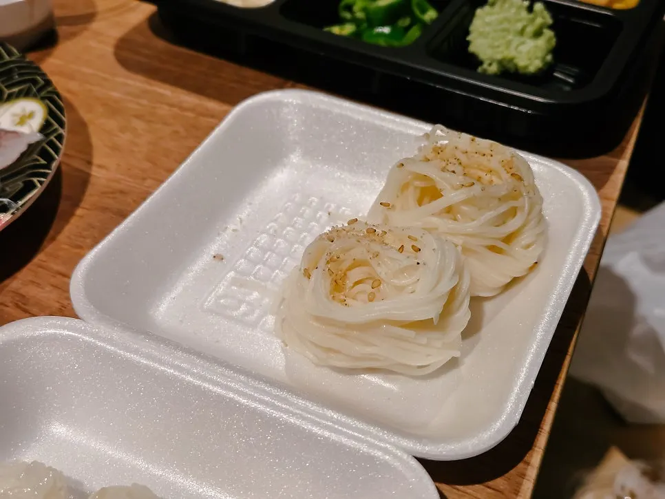 Containers of sushi rice and basic side dishes