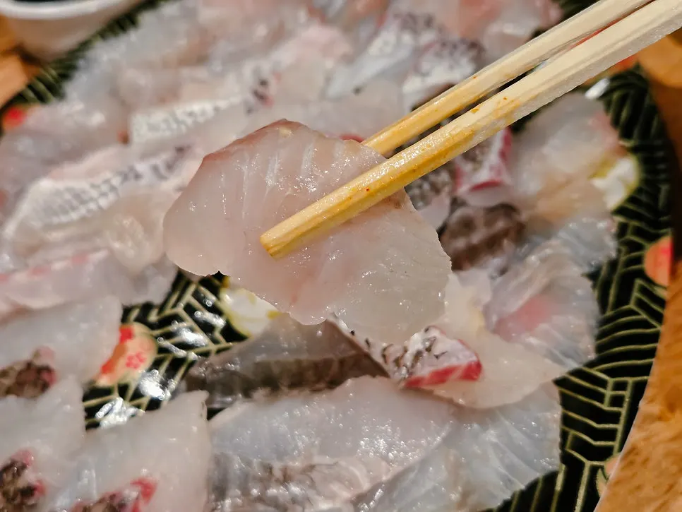 Close-up of assorted sashimi mixed with red sea bream yubiki