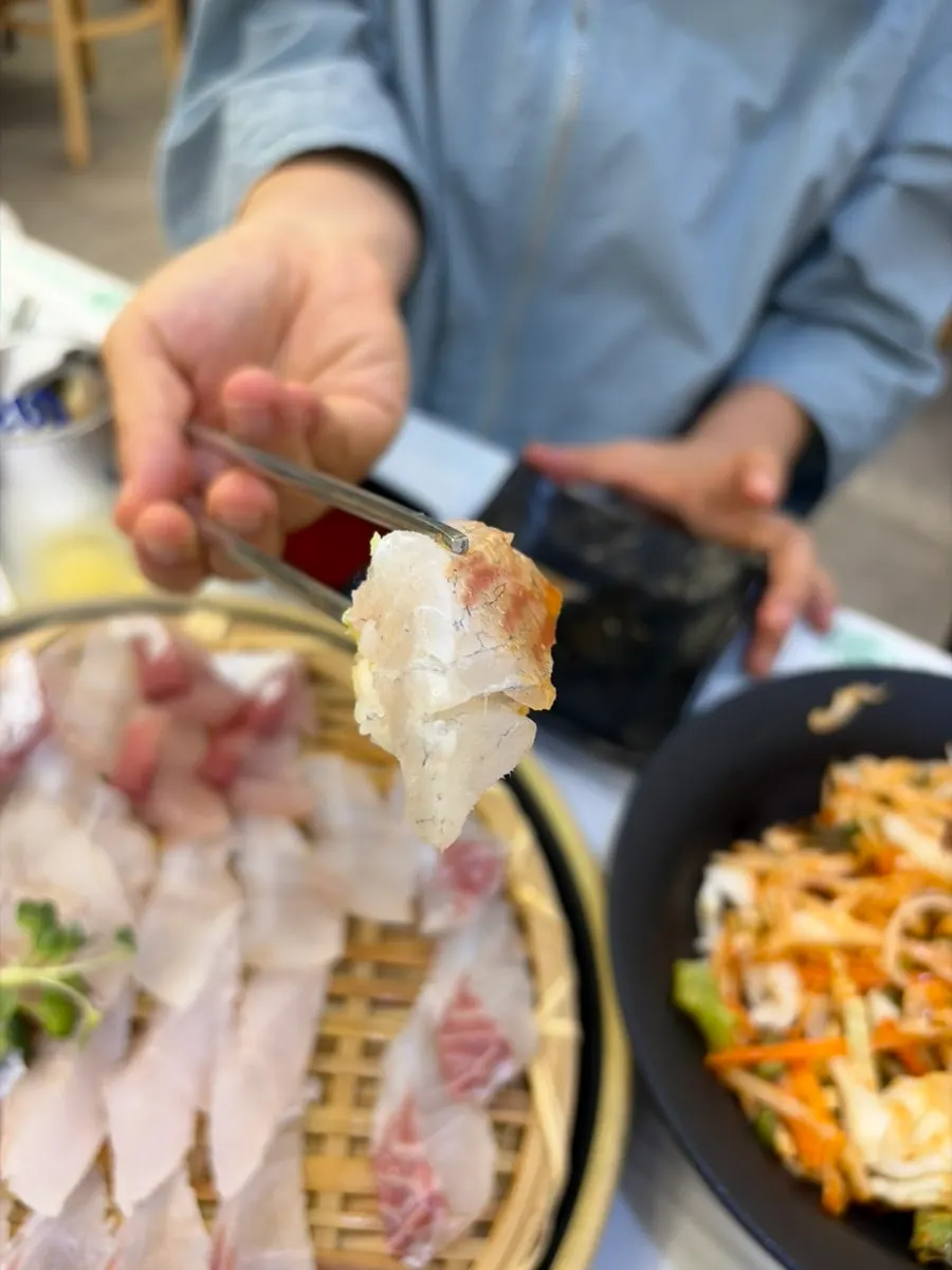 Close-up of sashimi sushi topped with wasabi