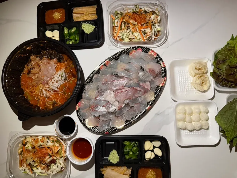 Takeout spread including sushi rice and thin wheat noodles