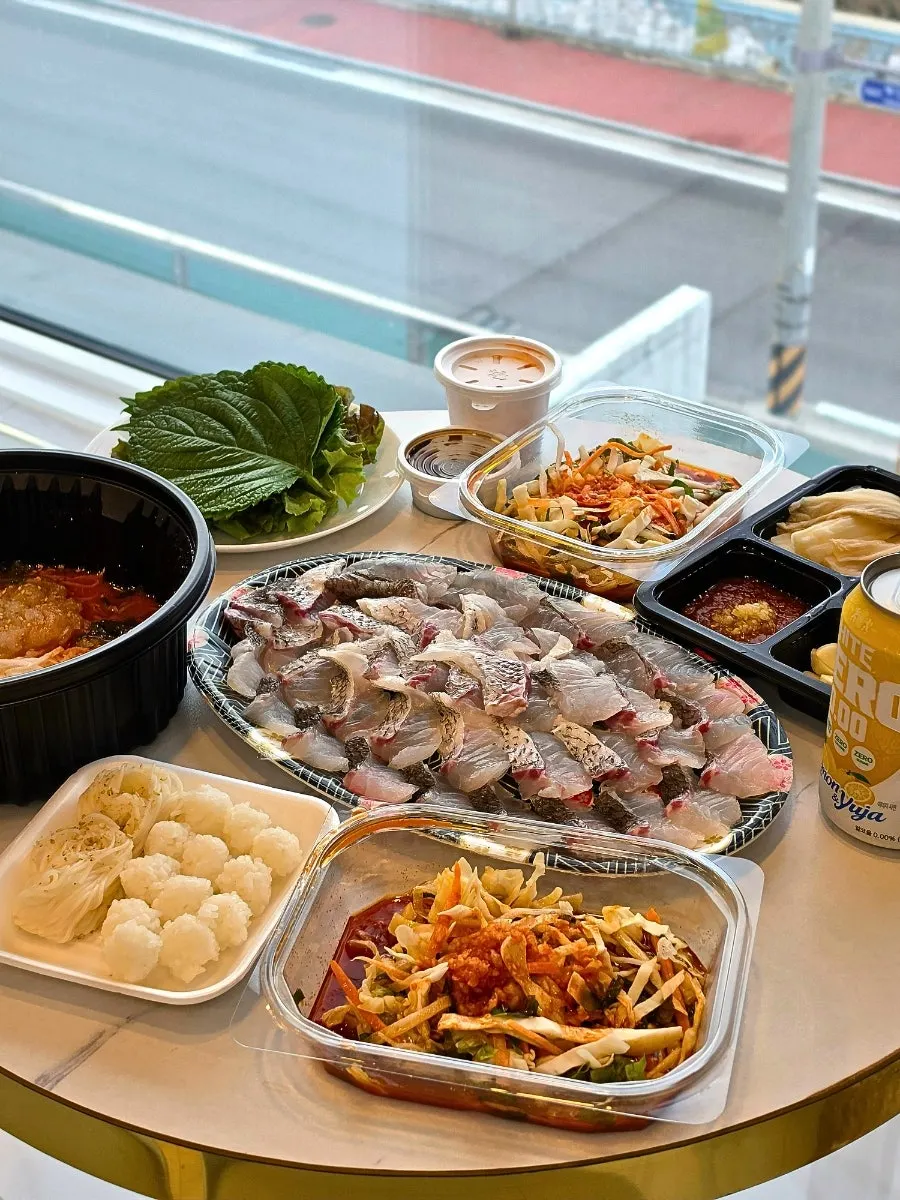 Takeout sashimi spread laid out at the pension