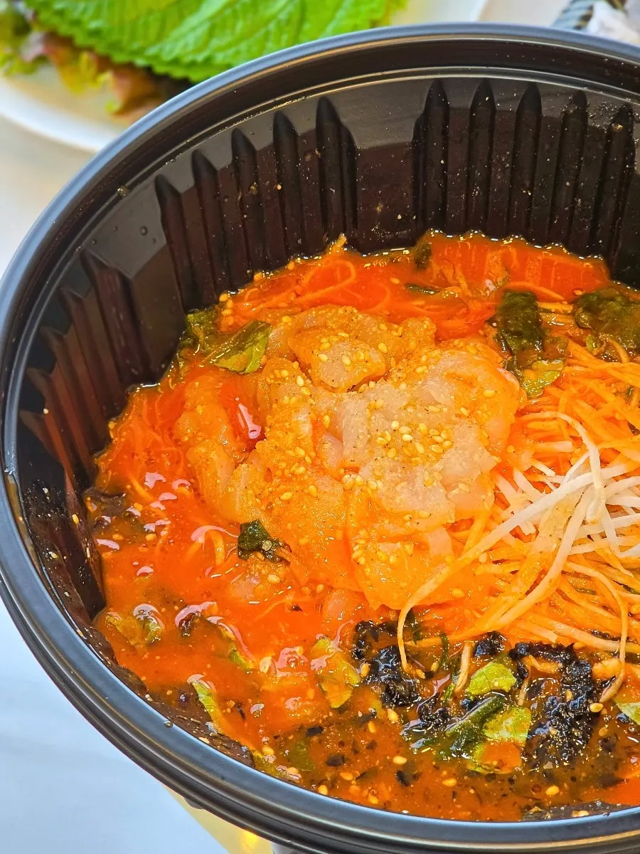 Thin wheat noodles served alongside the mulhoe
