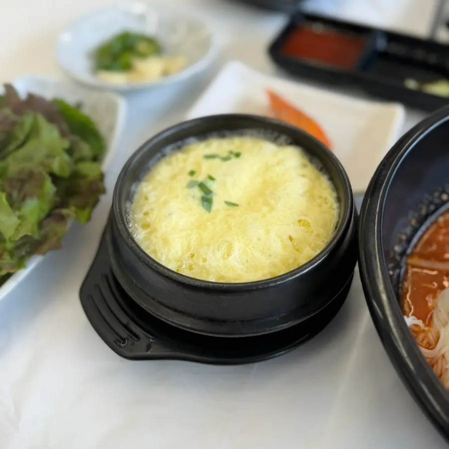 The soft steamed egg served alongside