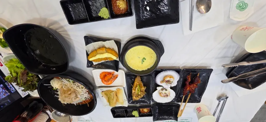Table full of side dishes and mulhoe
