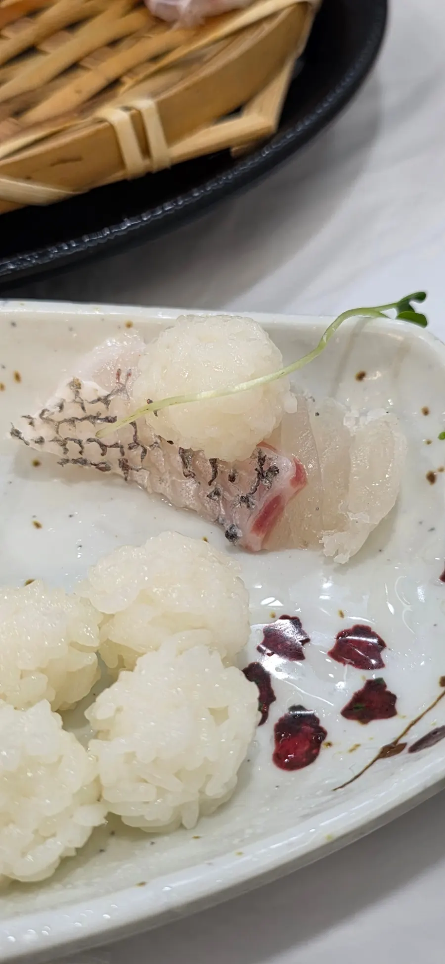 Reverse sushi with rice on top of the sashimi