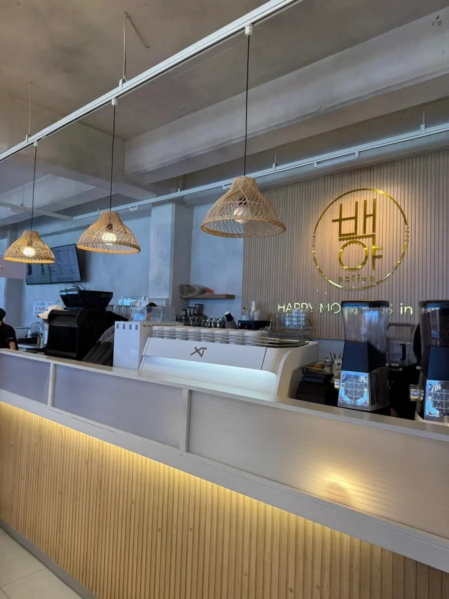 Baegya Coffee's building exterior and the direction to its own parking lot