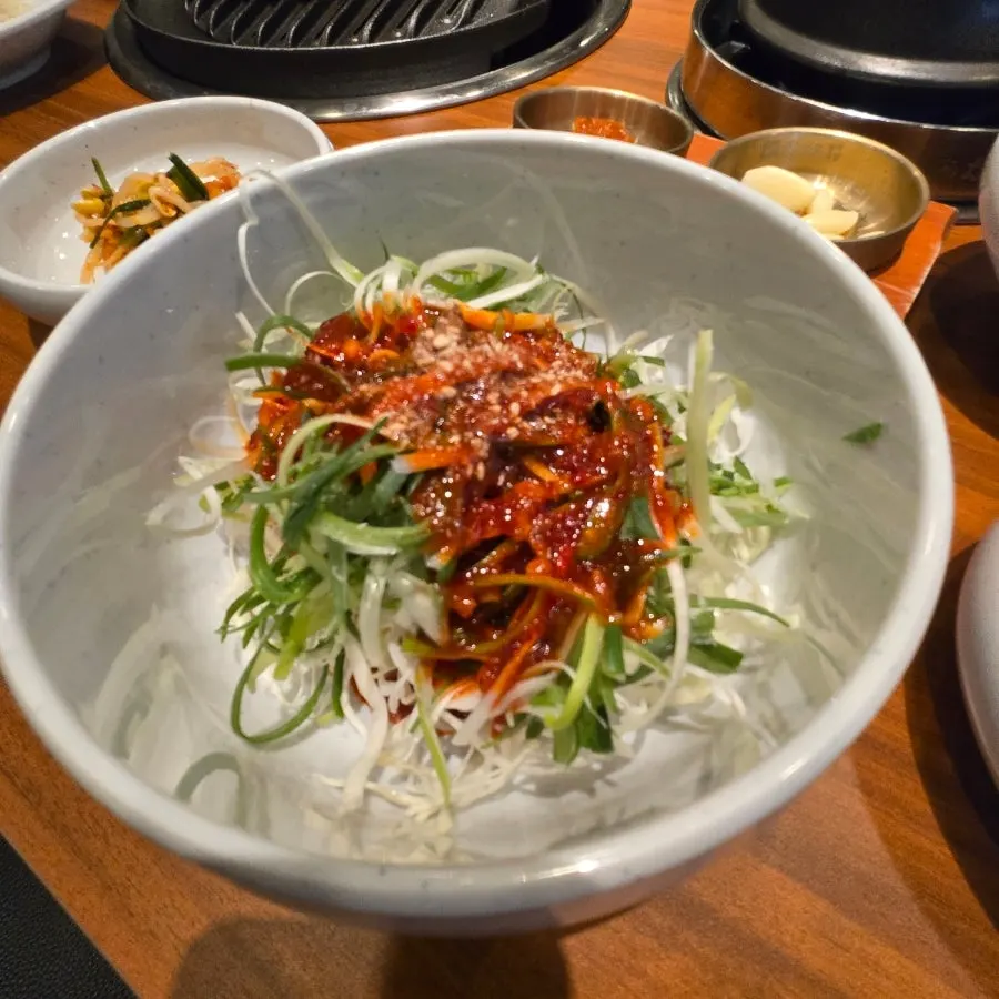 Warm doenjang jjigae simmering at the table