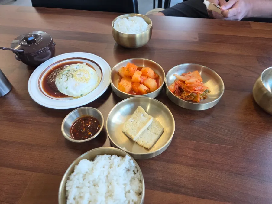 Menu board ranging from beef-bone broth to mala style
