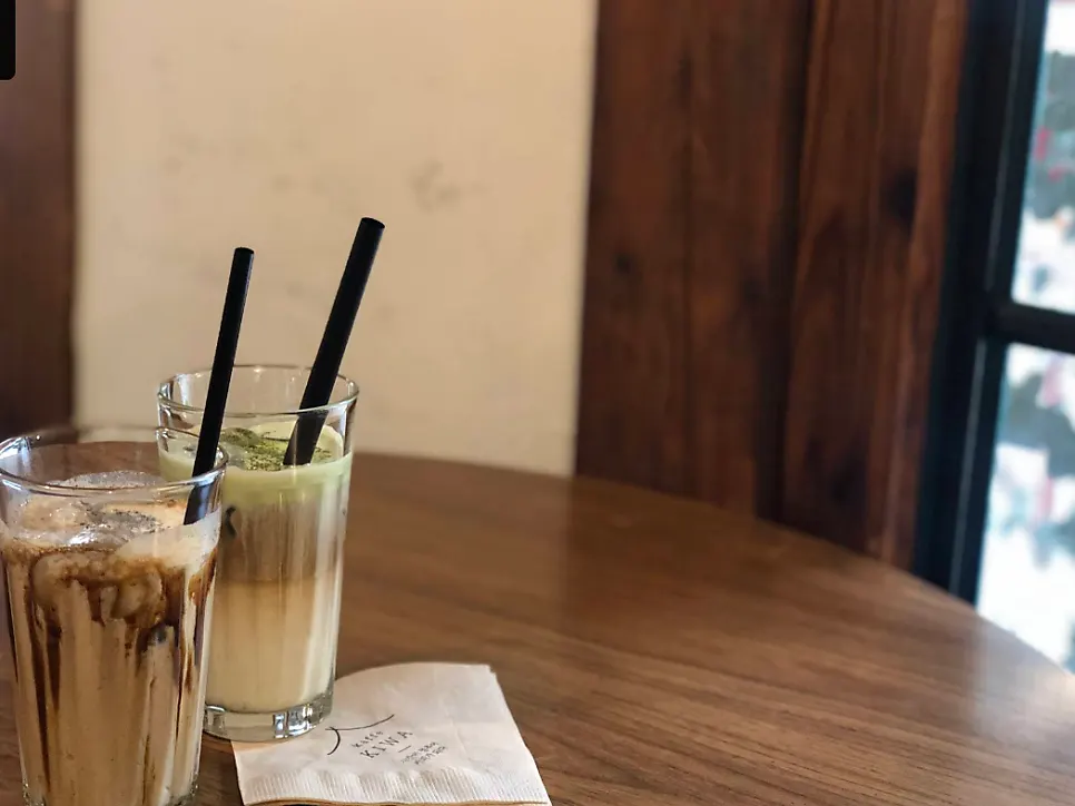 The signature black sesame latte on a table at Cafe Giwa