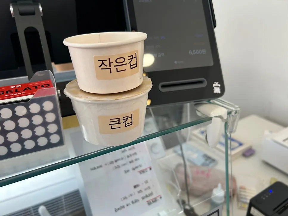 Menu board for choosing cup size and flavor at Hi Gelato