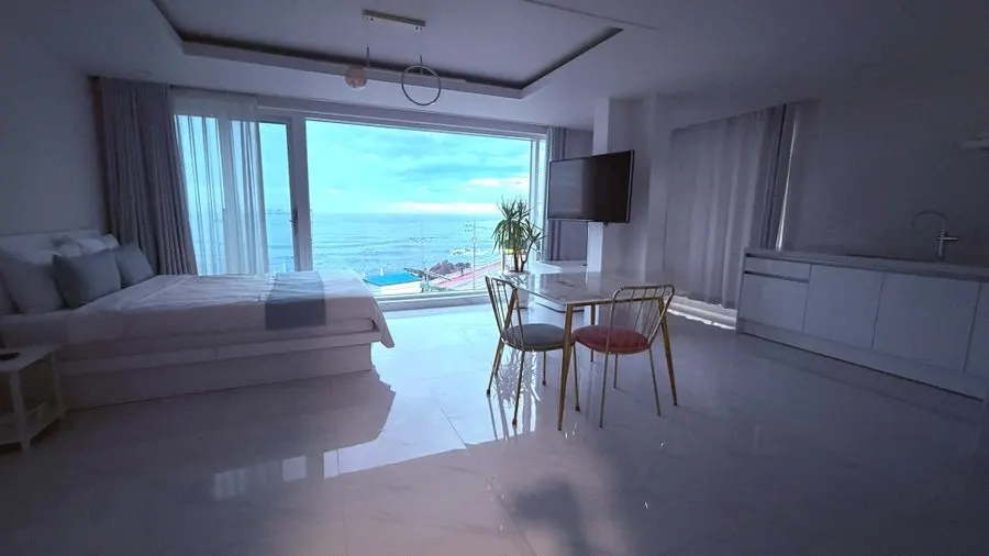 Floor-to-ceiling sea view visible the instant the door of Grasse 401 opens