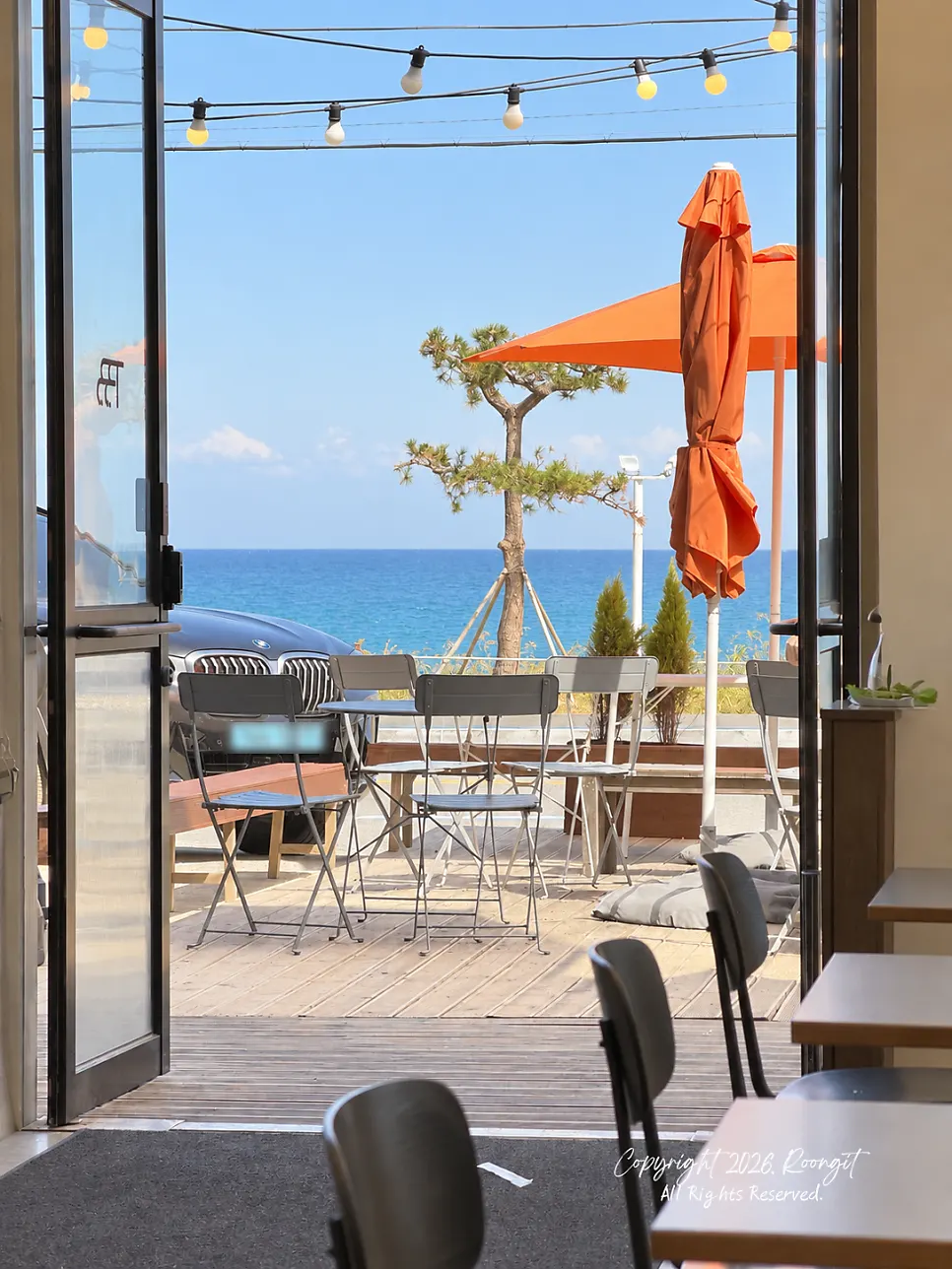 Ocean-view window seat with Sageunjin Beach visible