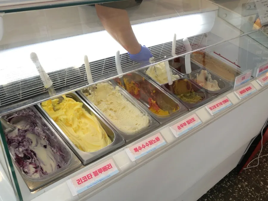 Display of various gelato flavors at Hi Gelato