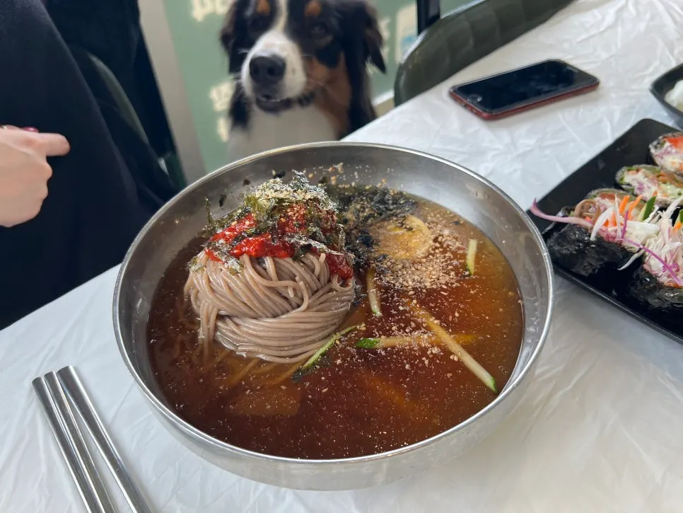 A spoonful of makguksu broth