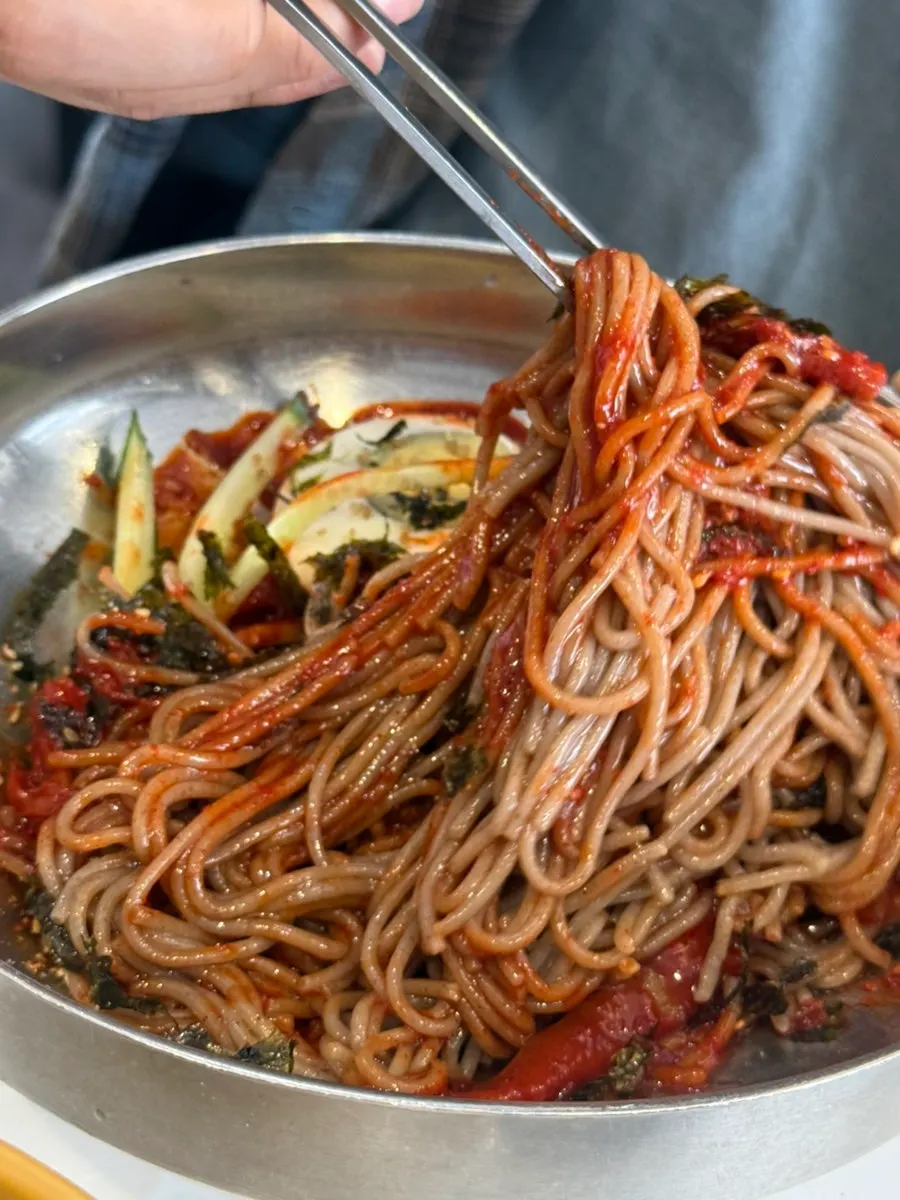 Pollock sikhae bibim makguksu with red seasoning