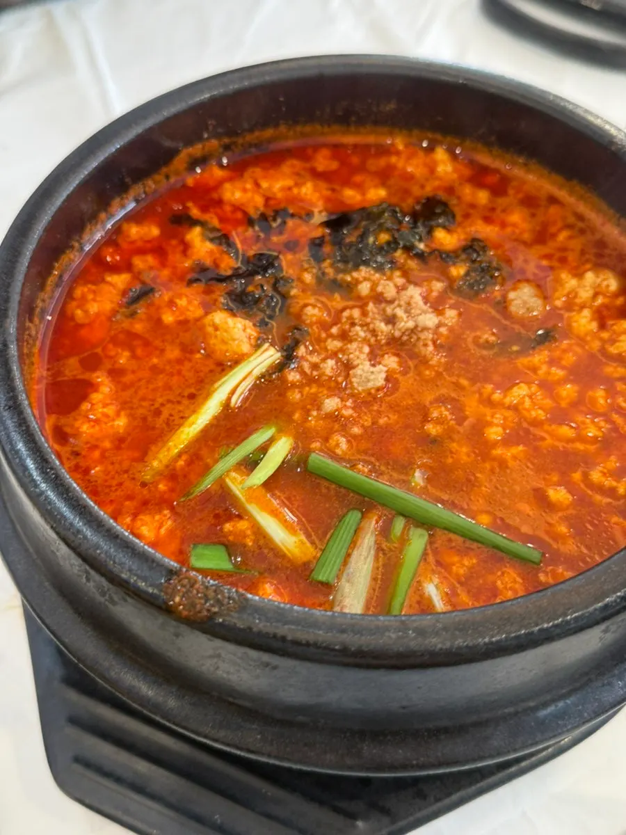 Spicy sundubu served in an earthenware pot
