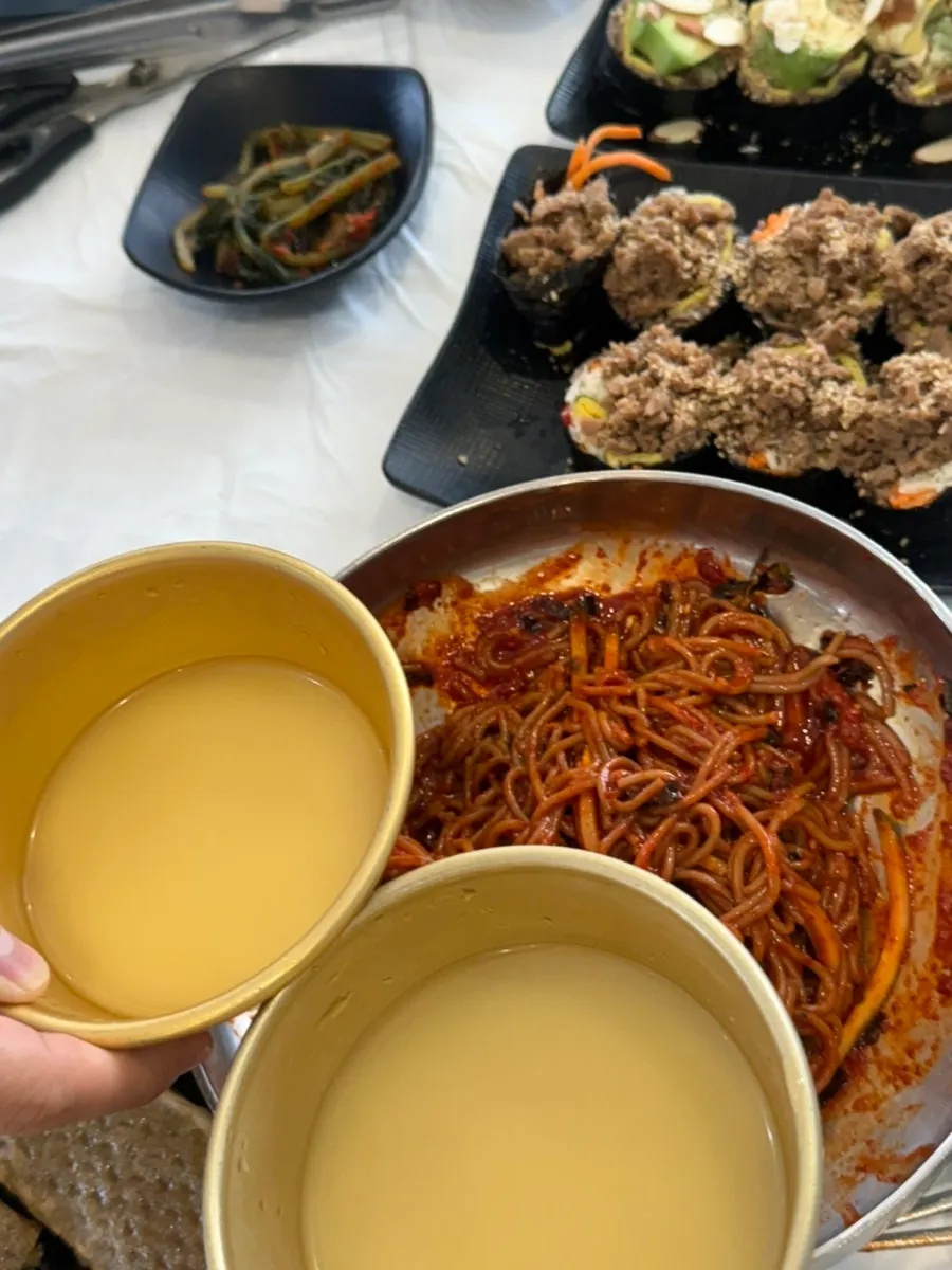 A pairing of spicy makguksu and fresh pumpkin makgeolli