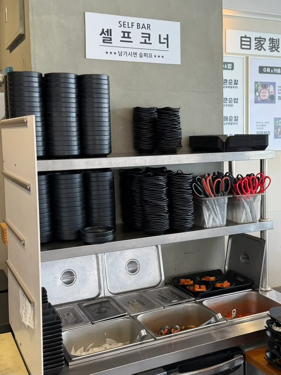 Second-floor tables and self-serve corner