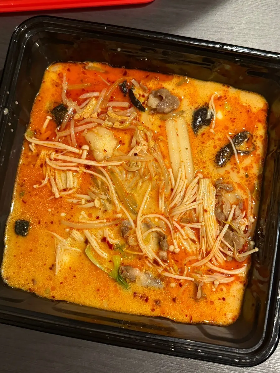 Carefully packed malatang container