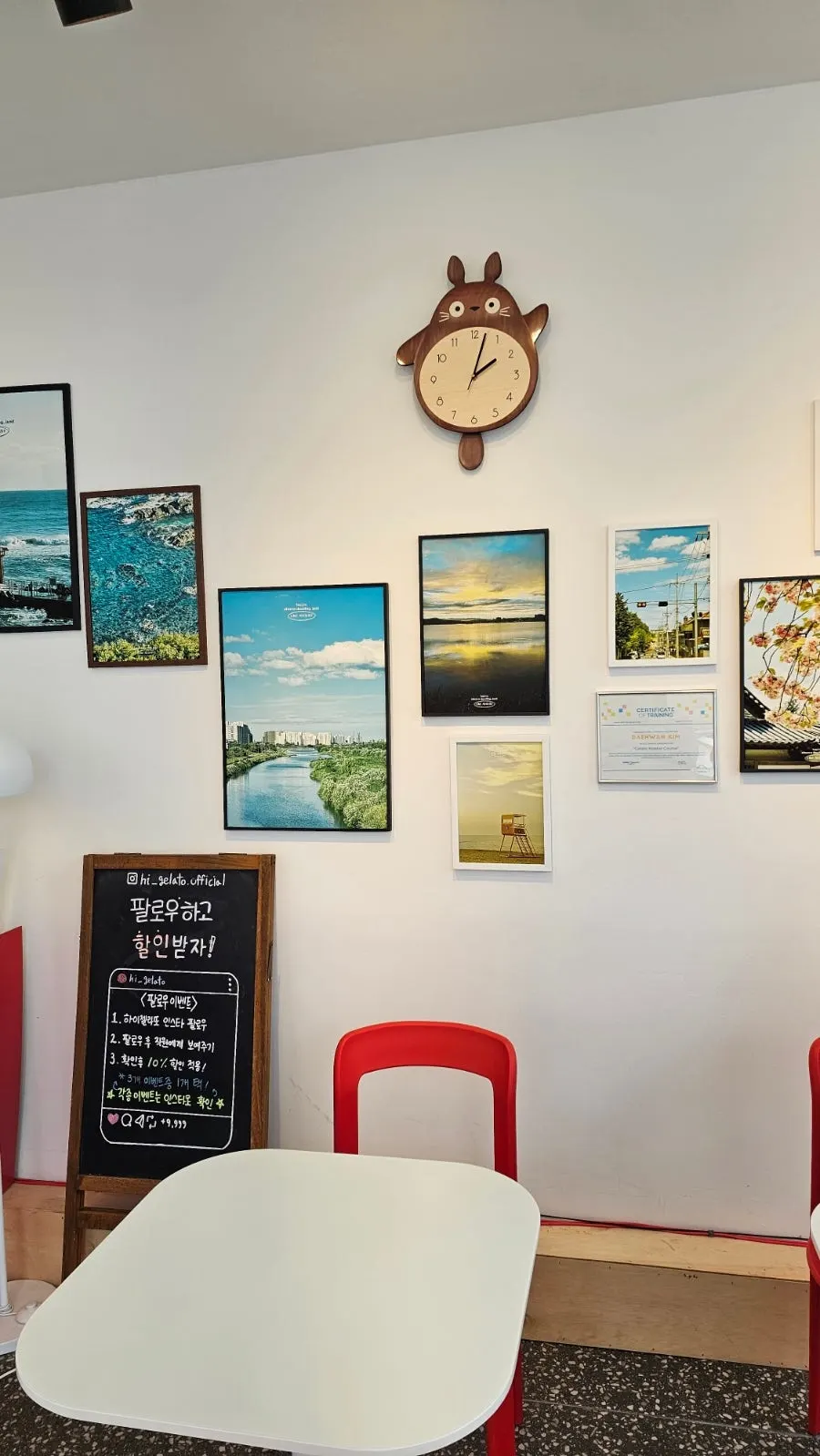 Store wall with framed photos of Gangneung scenery
