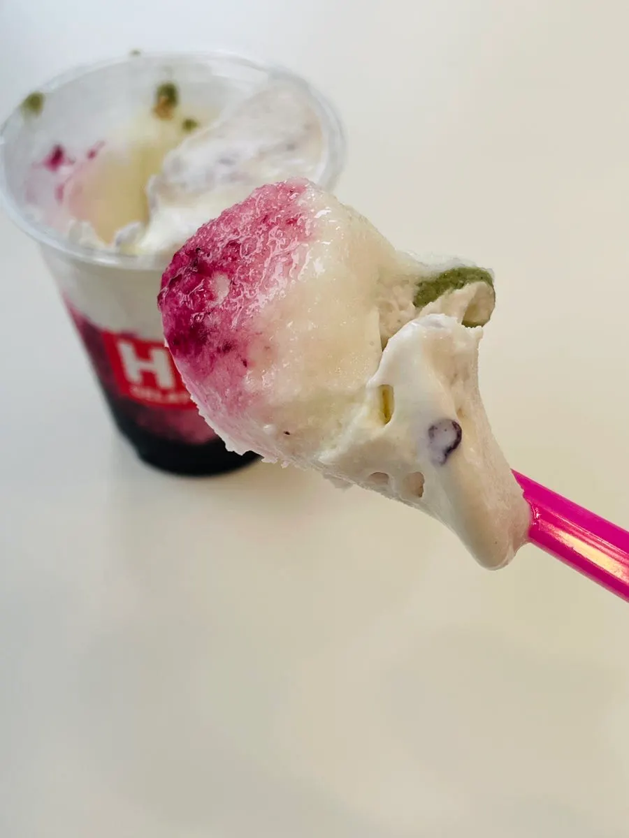 Scooping a bite of mugwort rice cake gelato