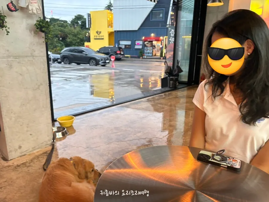 Yeoreum sitting quietly beside a table