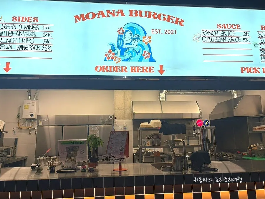 Food being cooked to order in Moana Burger's open kitchen