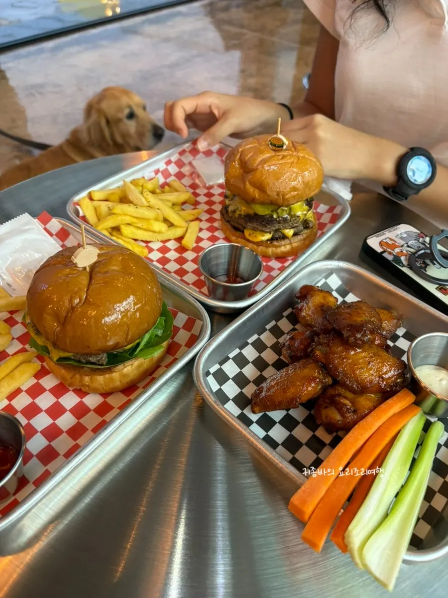 A full spread of Moana Burger, double burger, and buffalo wings