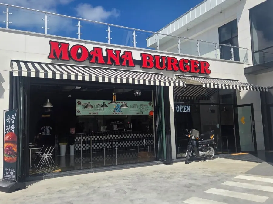 White-toned exterior and lettering of Moana Burger