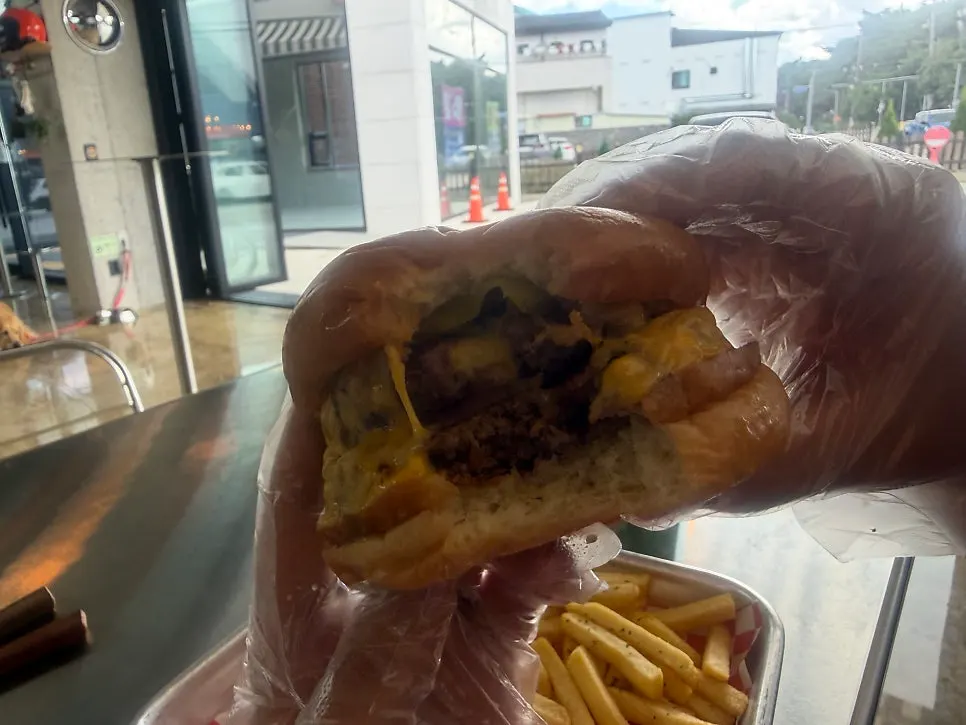 Handmade burger plated with fries