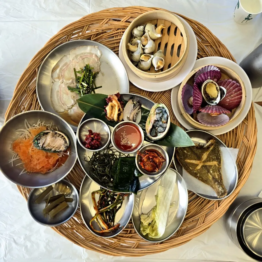 Haenyeo table set with 12 seafood side dishes