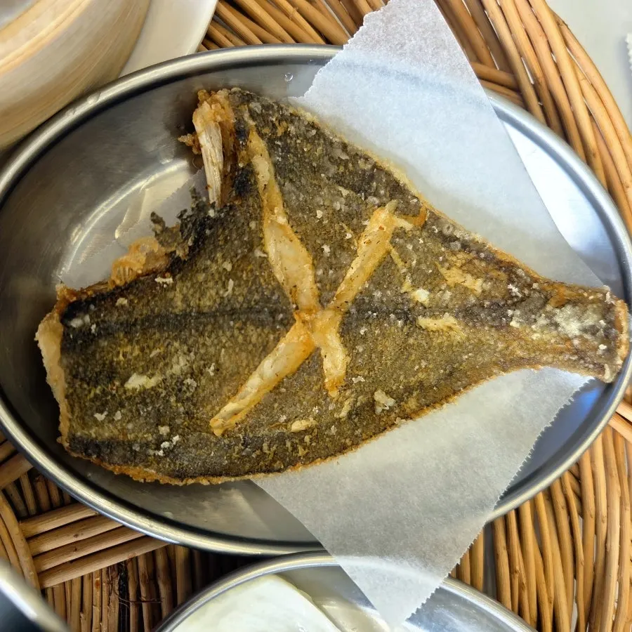 Plate of raw abalone and gorae seaweed side dish