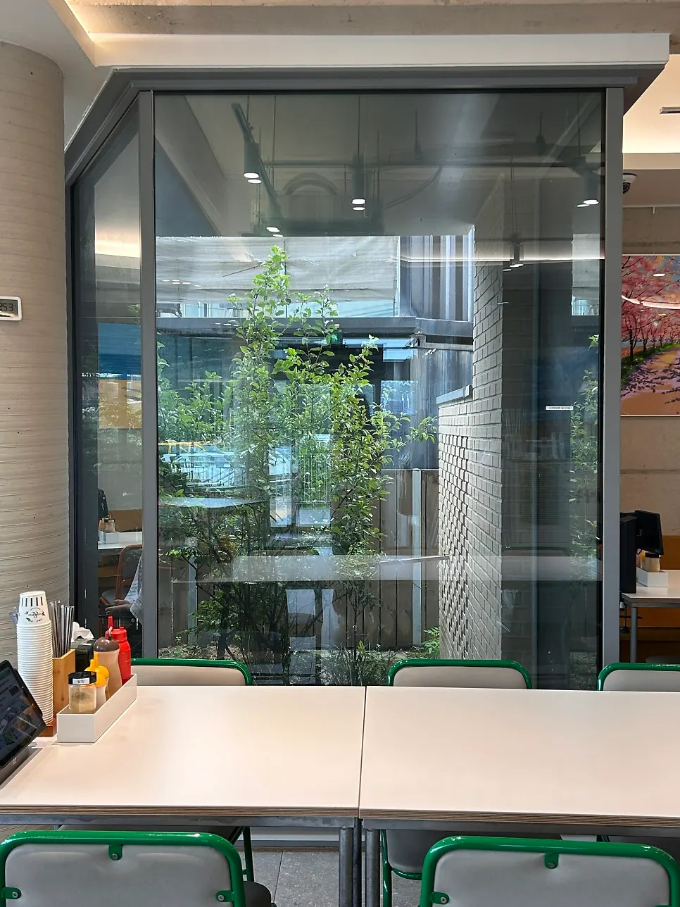 Small courtyard with green plants inside the restaurant