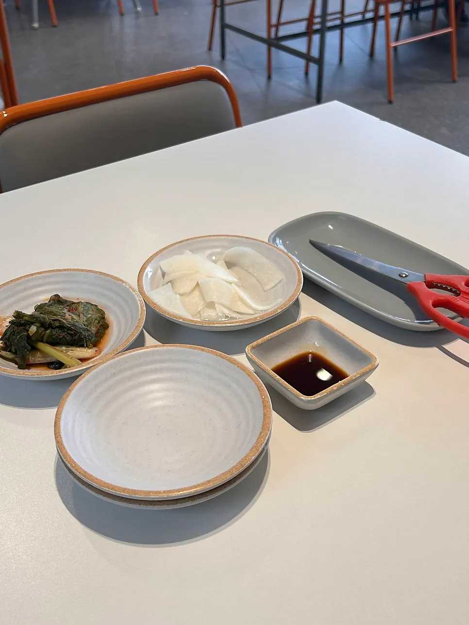Menu board listing makguksu and buckwheat crepe
