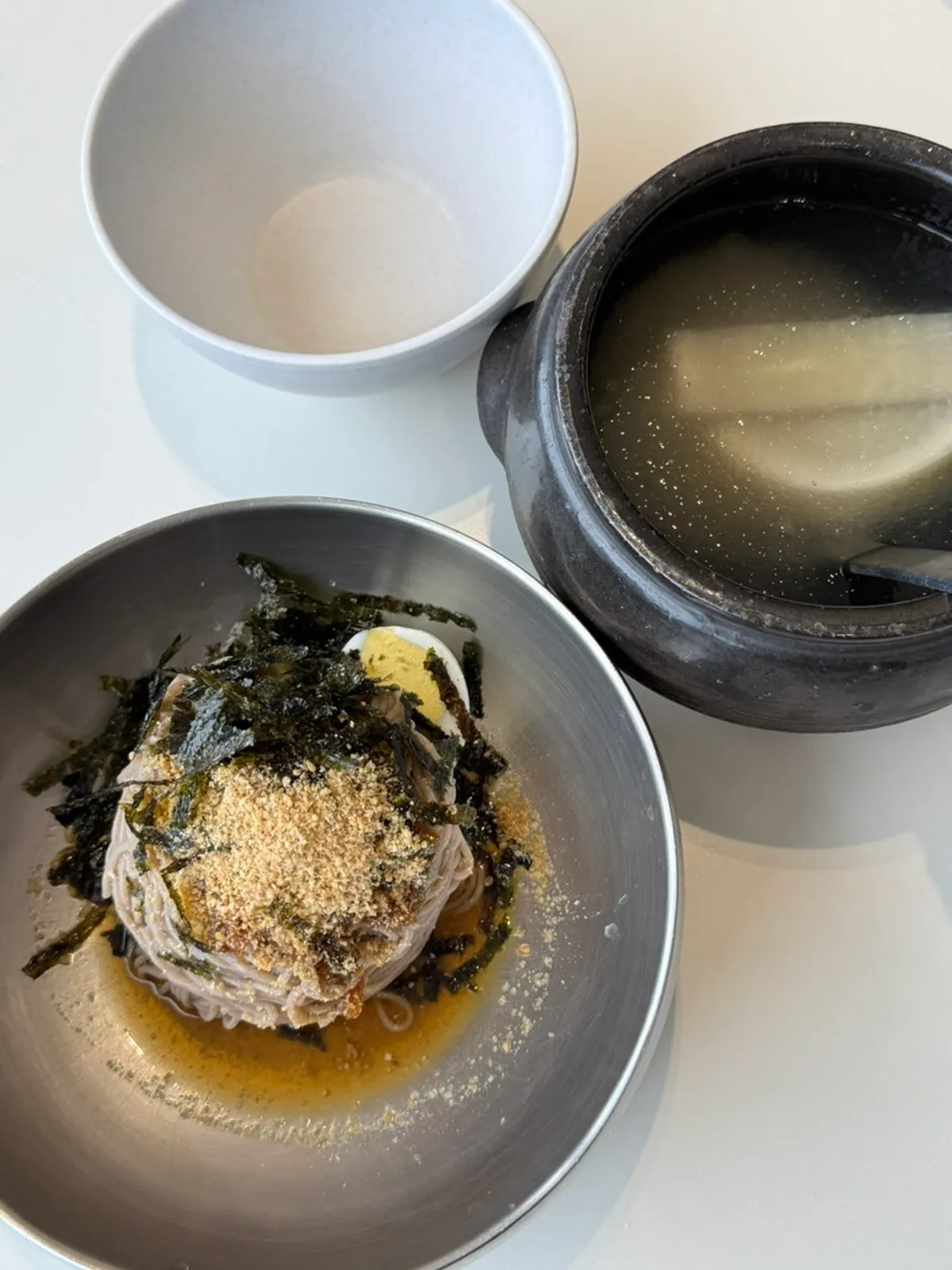 A bowl of dongchimi makguksu topped with icy slush