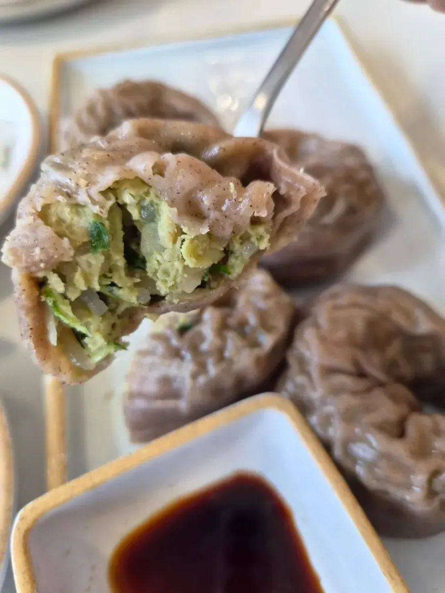Buckwheat dumpling cut in half showing the filling
