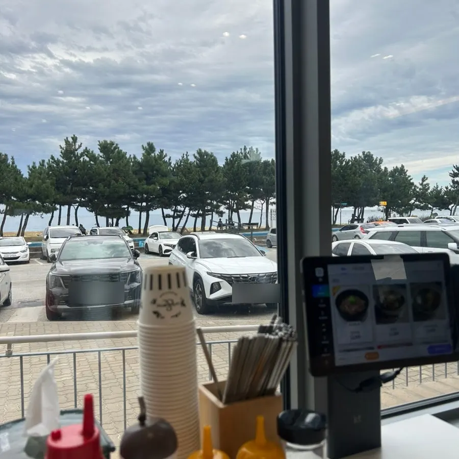Window-side seat with a view of the beach