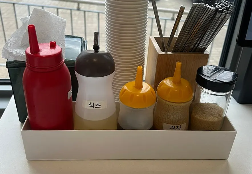 Makguksu sauce, vinegar, and perilla oil on the table