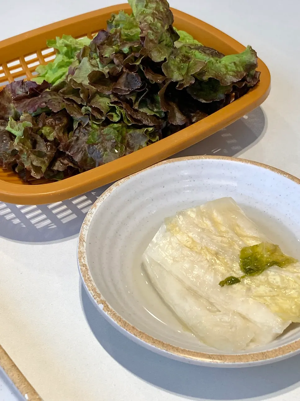 Lettuce and baek-kimchi served with the sujuk