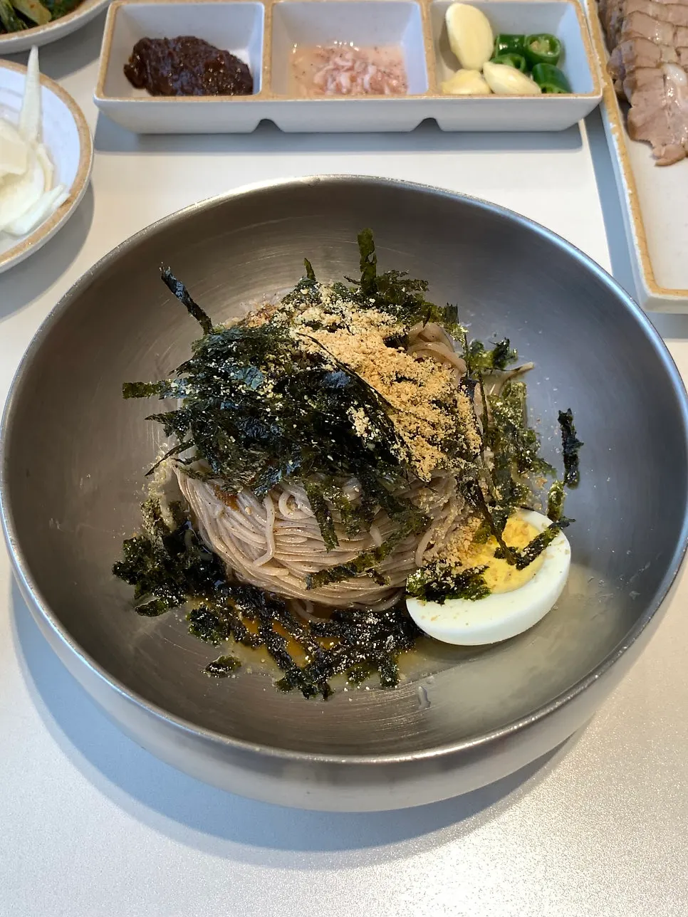Dongchimi makguksu with thin ice floating in the broth