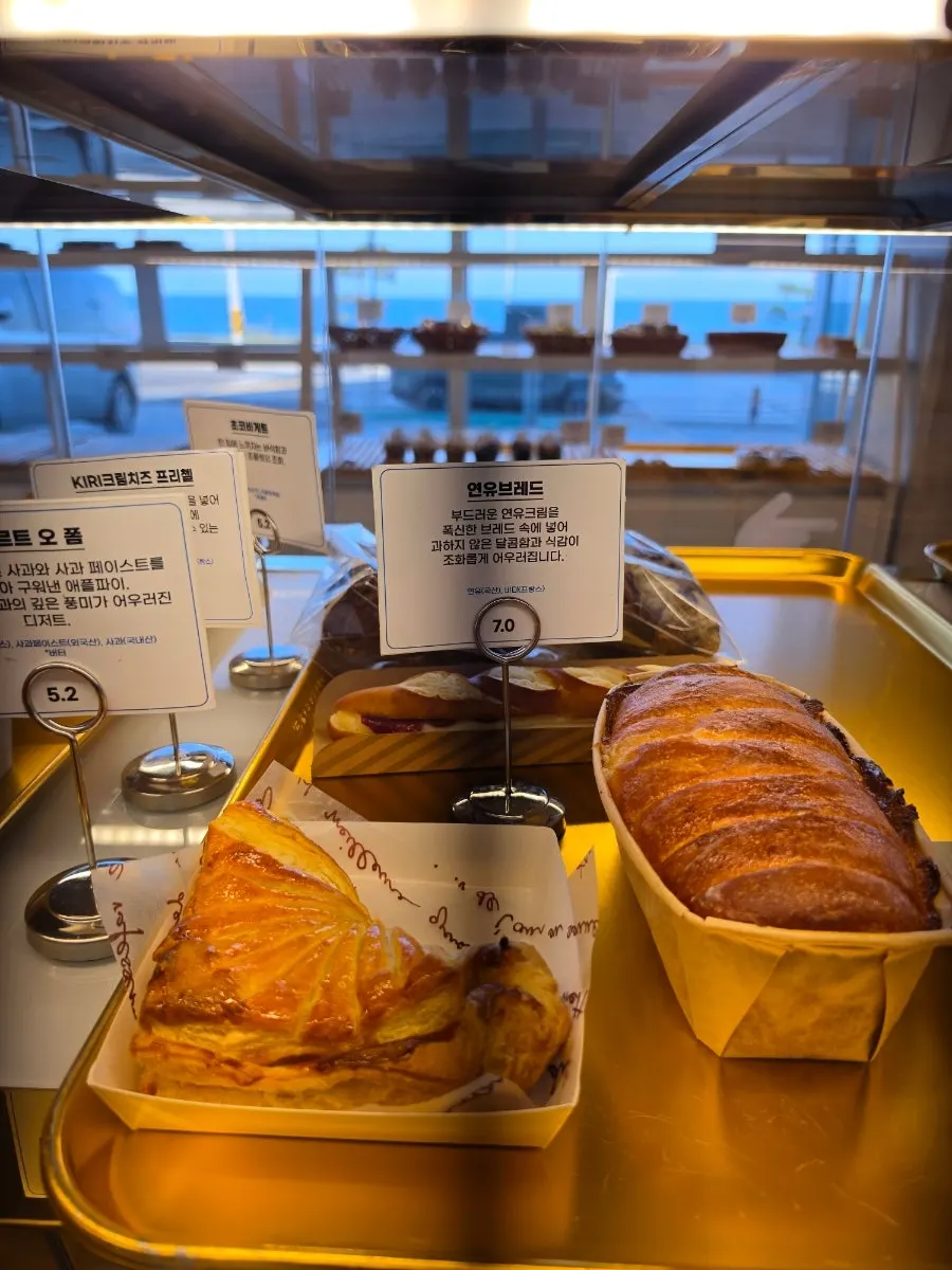 Various breads on the display shelf at Baegya Coffee