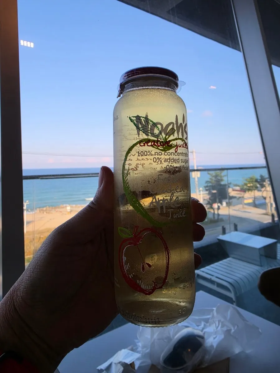 Bottle of 100% apple juice at Baegya Coffee